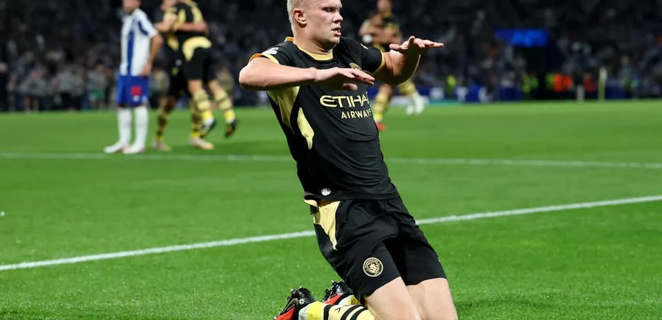 Player celebrating on knees after scoring a goal