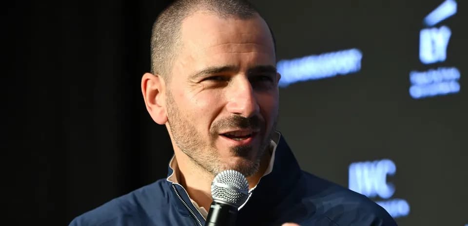 Speaker discussing at event with microphone in hand