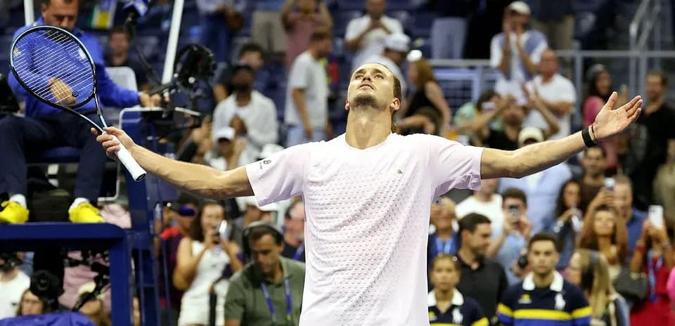 Player celebrating victory at tennis match