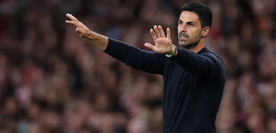 Coach gesturing during a match from the sideline