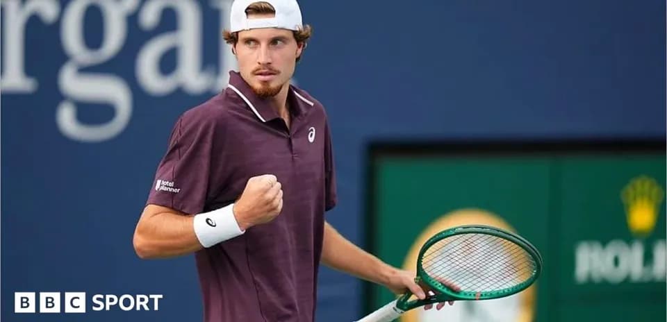 Tennis player celebrating a point on court