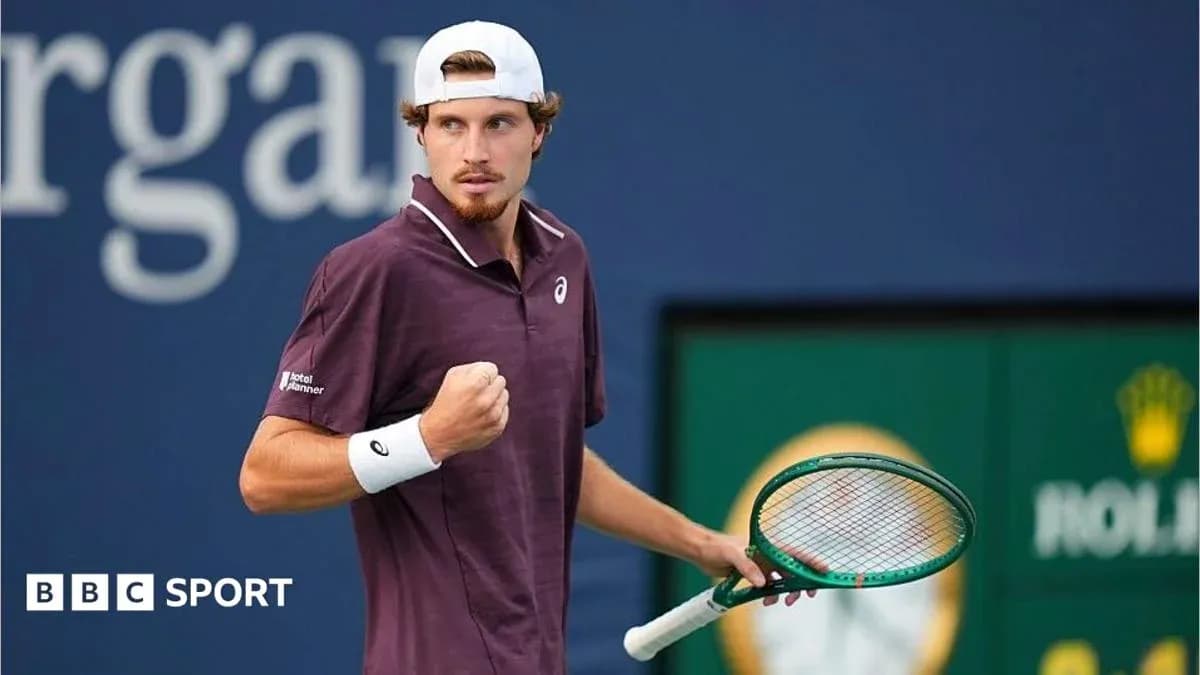 Tennis player celebrating a point on court