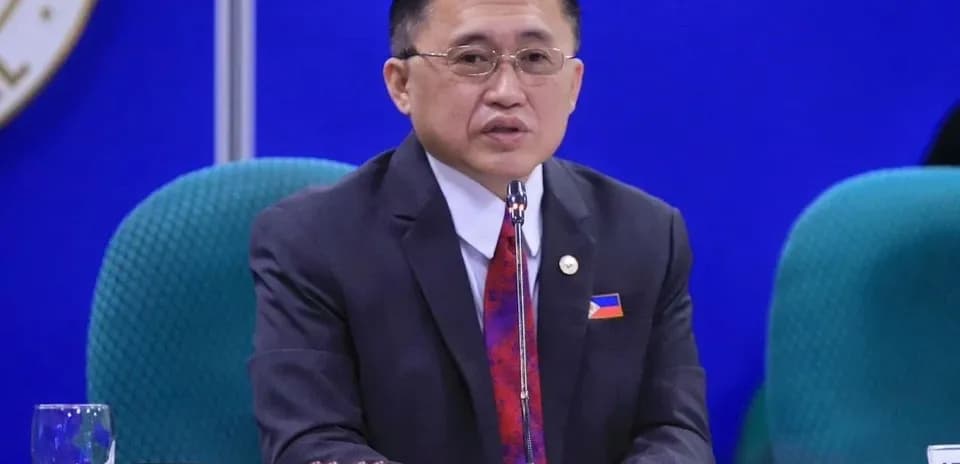 Official speaking at a formal meeting table