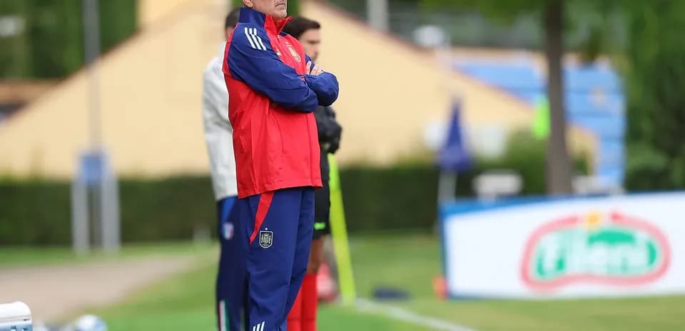 Coach observing players during training session