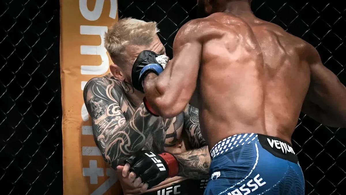 Two fighters exchanging blows in the octagon