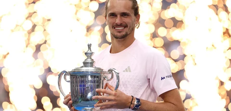 Player holding trophy with fireworks in background