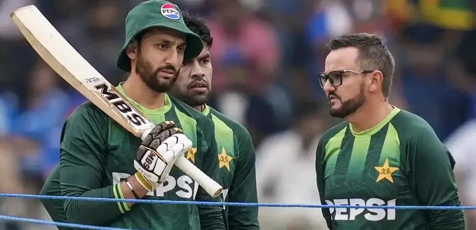 Cricketers discussing strategy during a match break