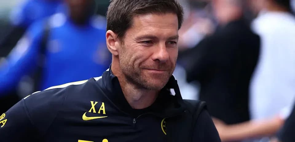 Coach walking in training gear before match