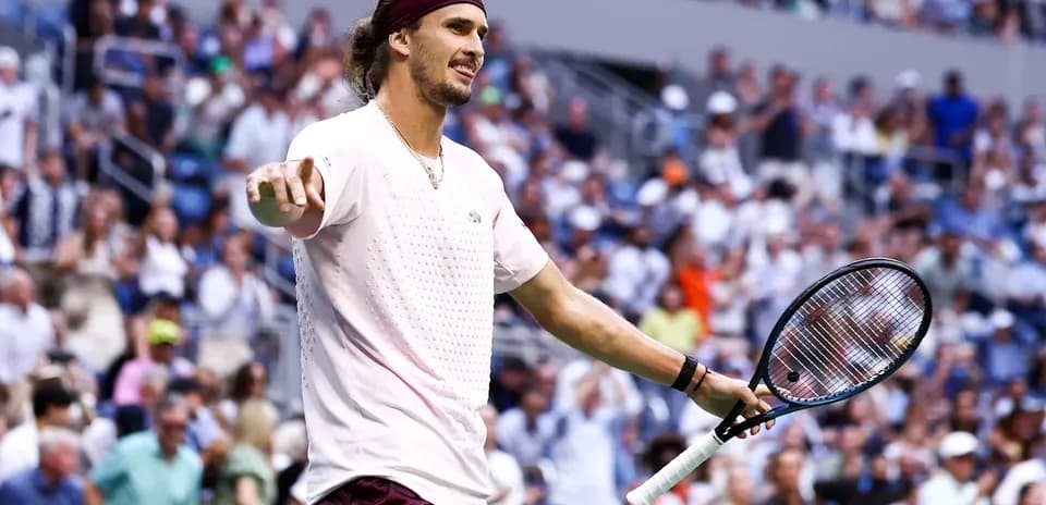 Tennis player gesturing during match at stadium