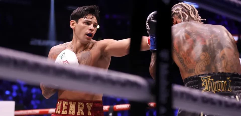 Boxer throwing a punch in the ring