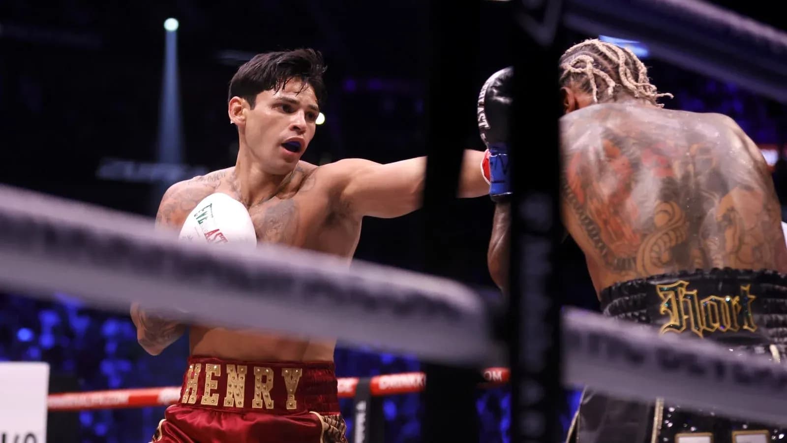 Boxer throwing a punch in the ring