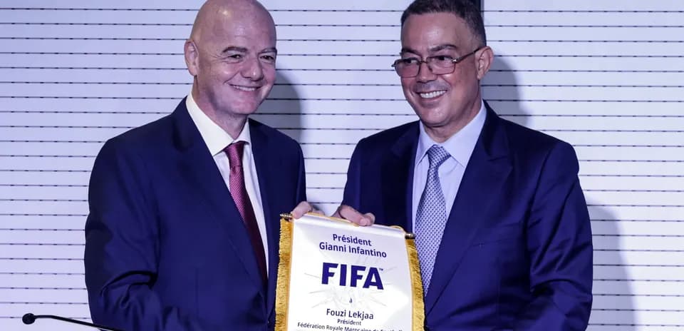 Gianni Infantino presenting FIFA banner to Fouzi Lekjaa