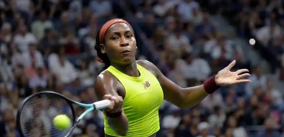 Coco Gauff returning a serve during a match