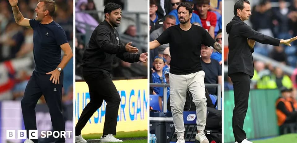 Four football managers coaching during a match