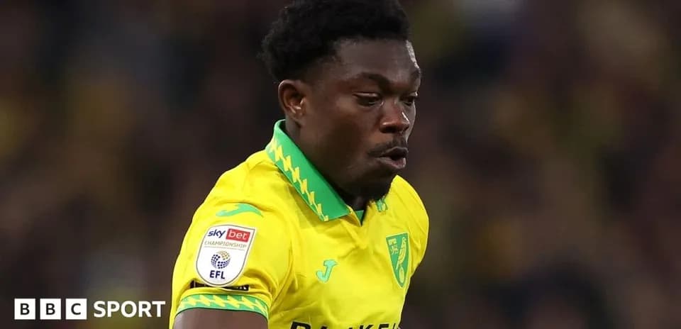 Player in yellow kit running on the pitch