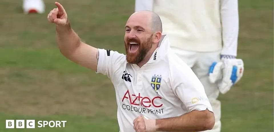 Cricketer celebrating after taking a wicket