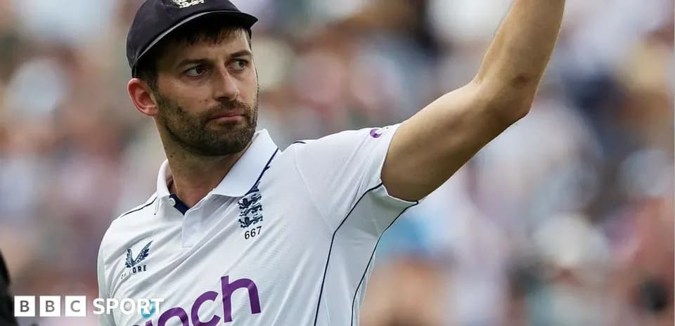 Cricketer raising hand during match celebration