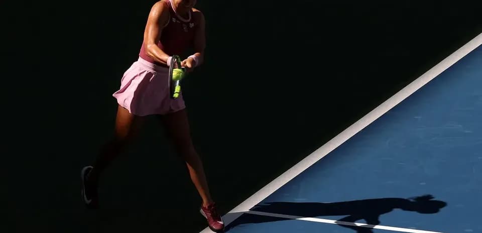 Player hitting a tennis ball on the court