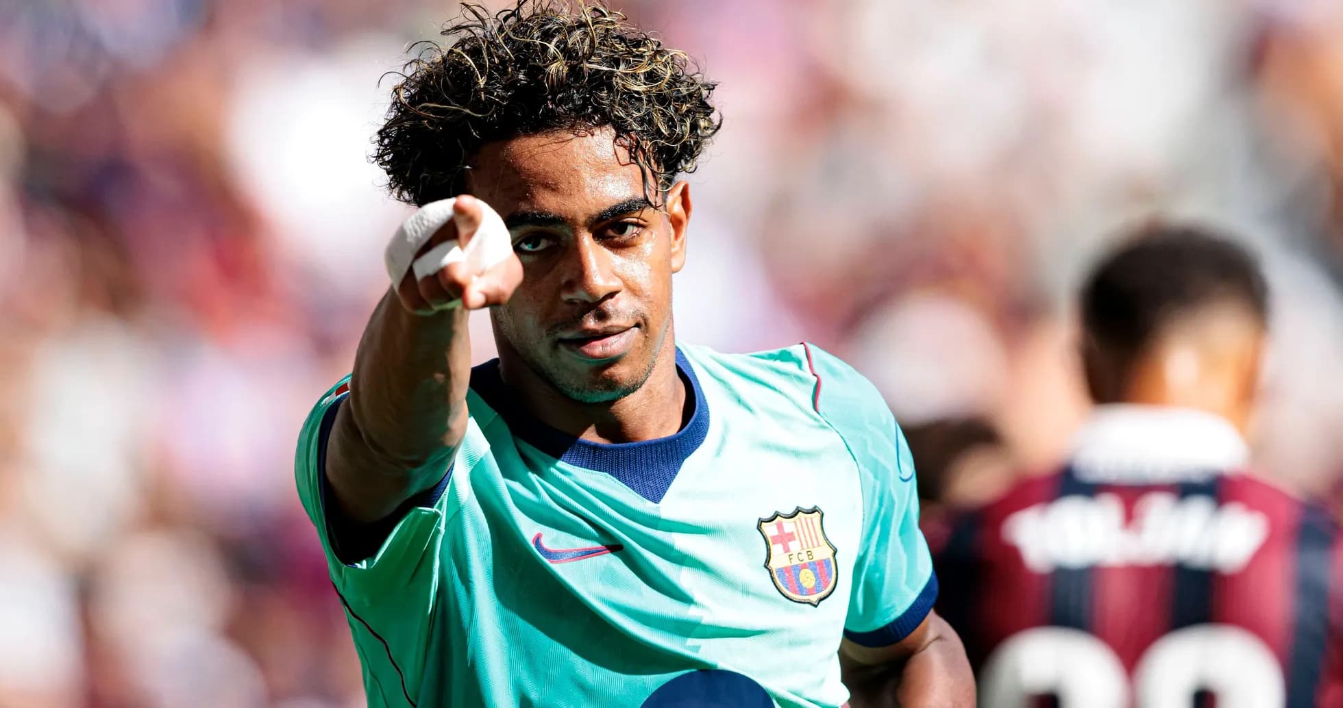 Player celebrating and pointing during match action