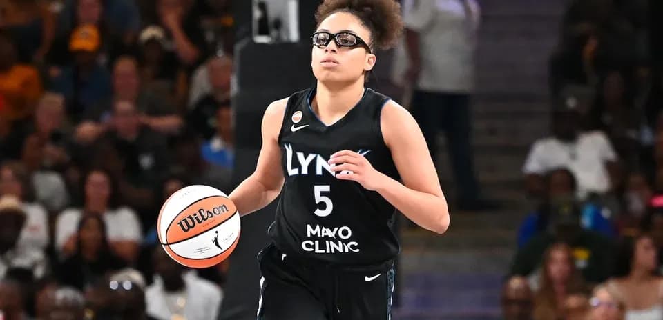 Player dribbling ball during basketball game