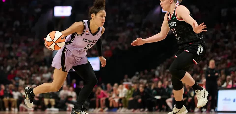 Player dribbling basketball during competitive match