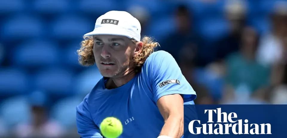 Player hitting tennis ball during match on court