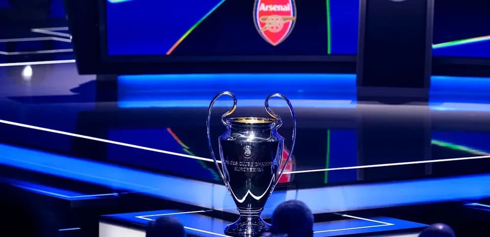 Champions League trophy displayed on stage