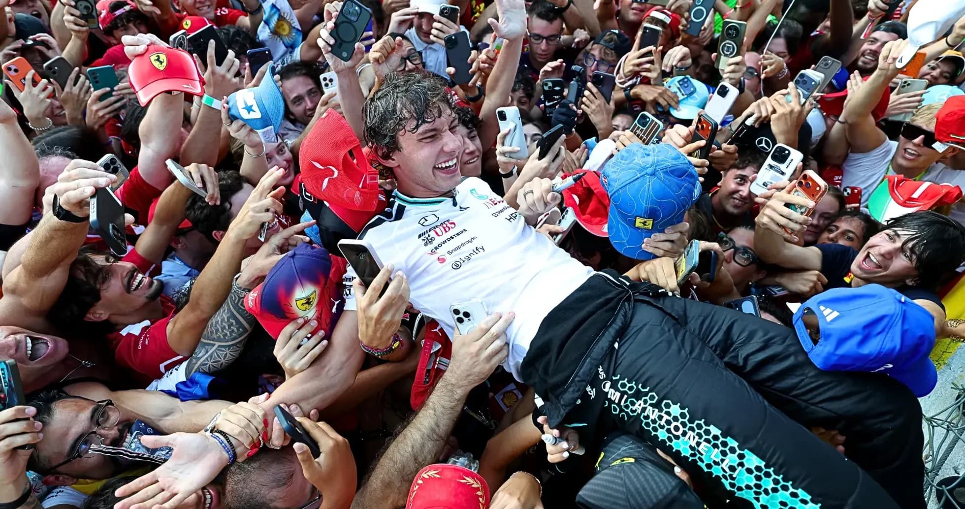 Driver celebrating with fans after race victory
