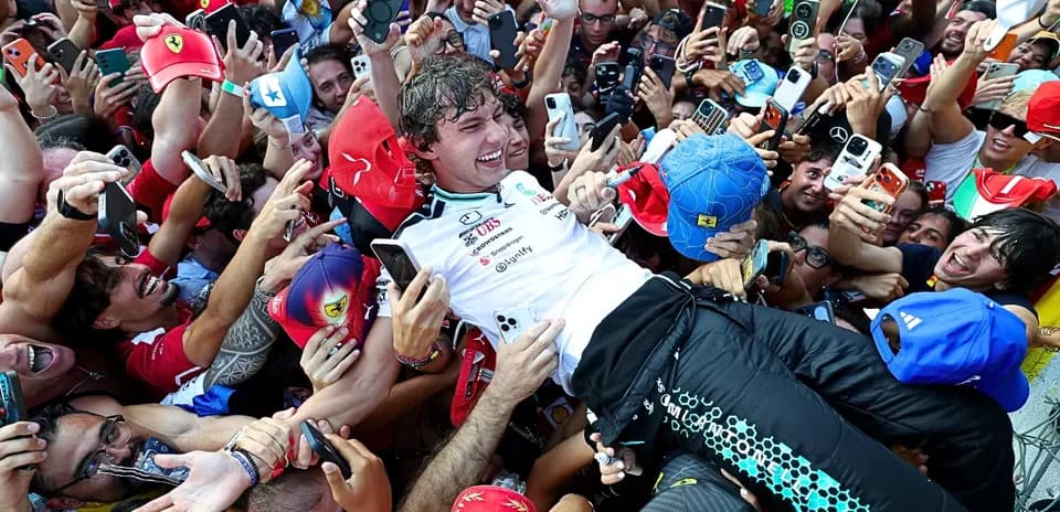 Driver celebrating with fans after race victory