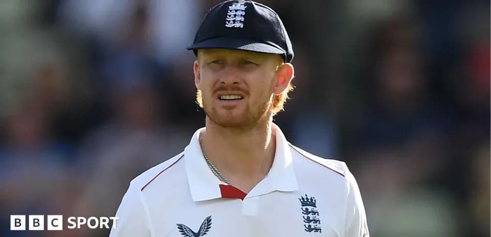 Cricketer wearing England team uniform and cap