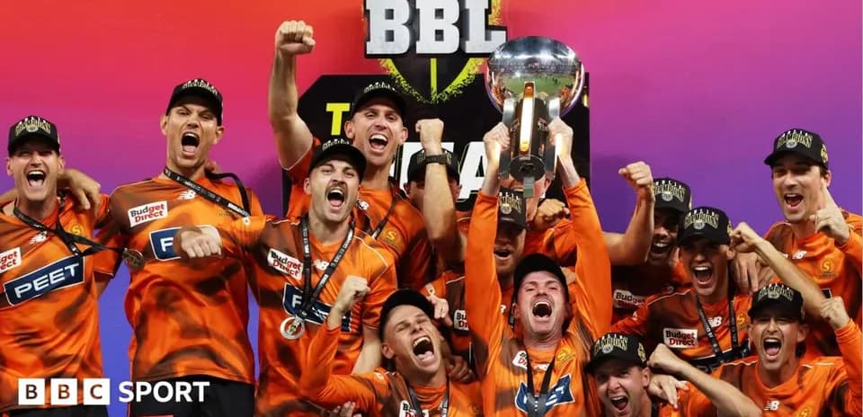 Team celebrating with trophy after BBL championship victory