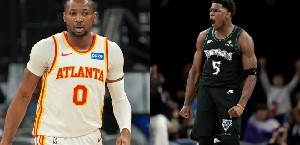 Two basketball players in team jerseys during game