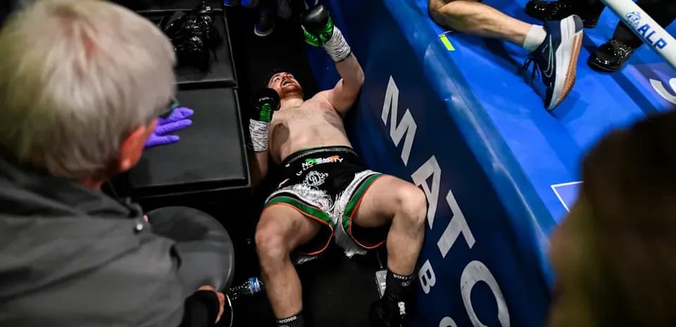 Boxer lying on the floor after a match
