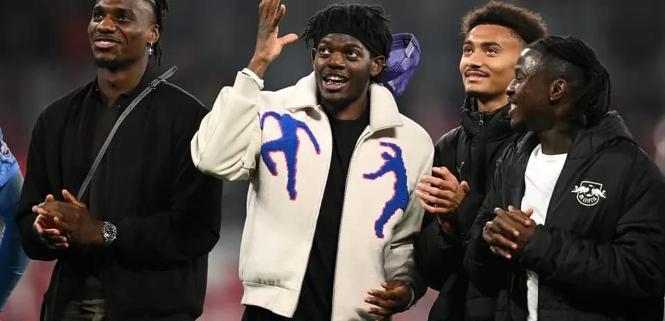 Four players celebrating together at an event