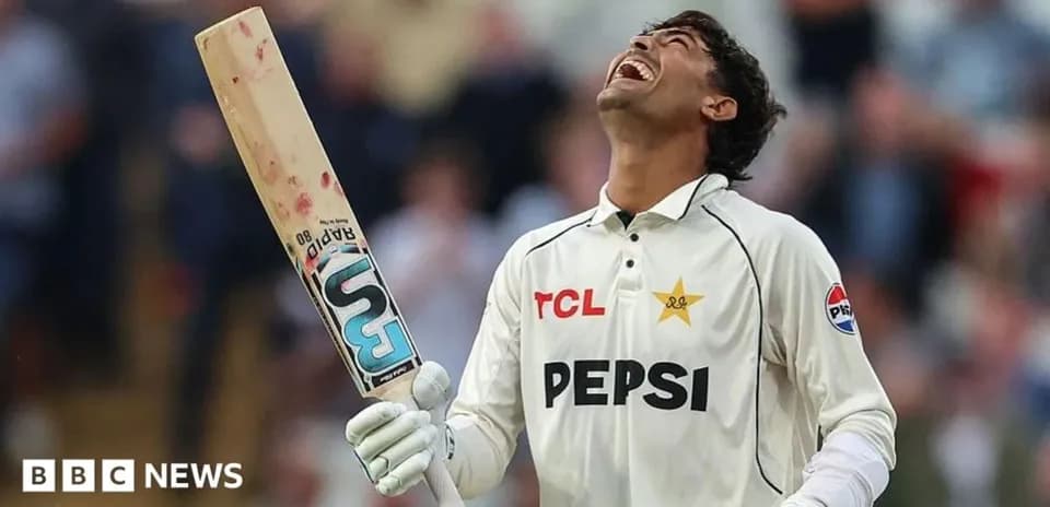 Cricketer celebrating with bat after scoring runs