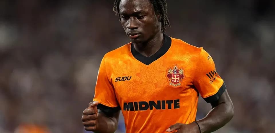Player in orange jersey during match action
