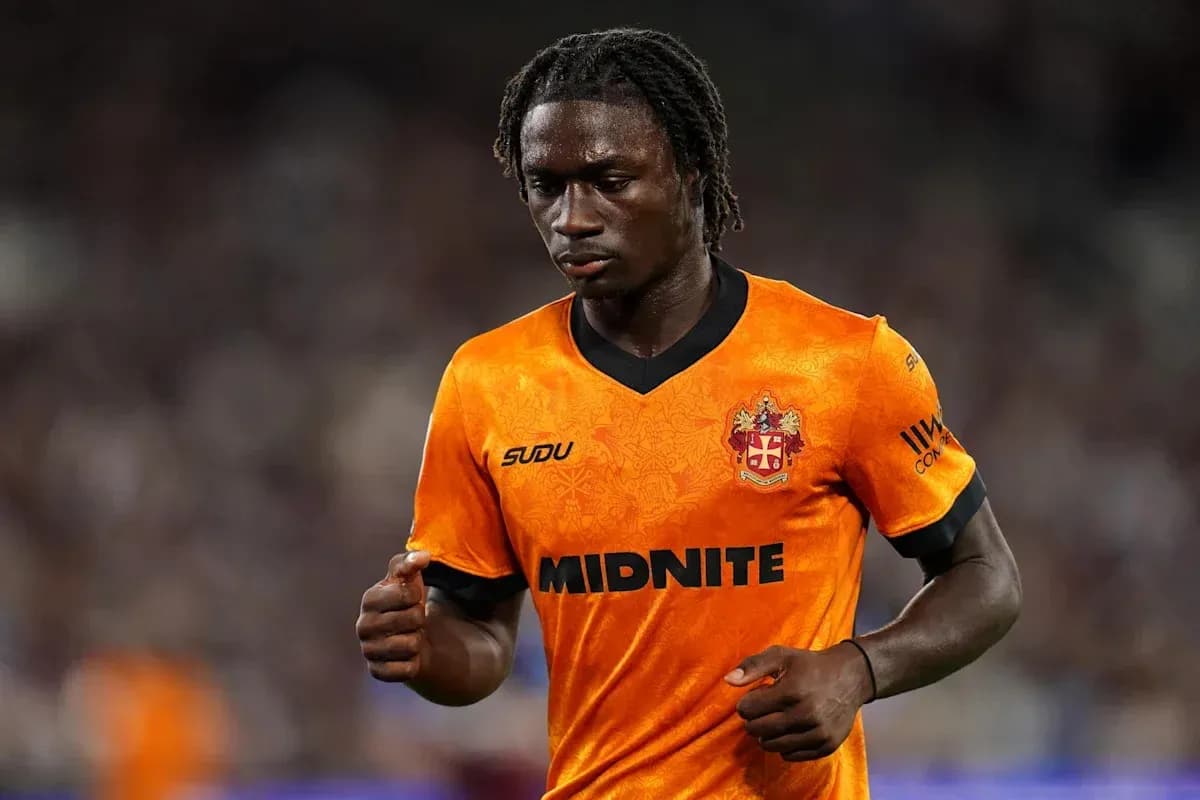 Player in orange jersey during match action