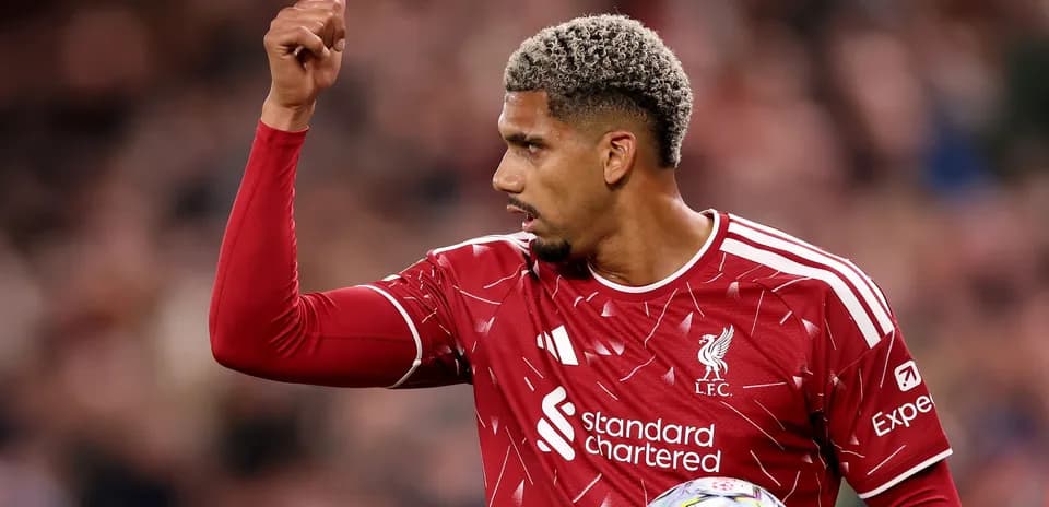 Liverpool player signaling during match action