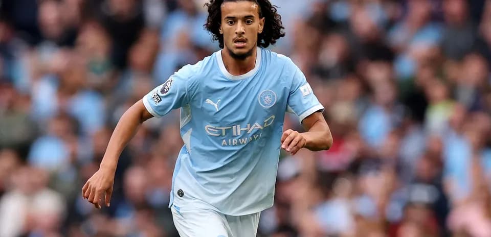 Player running with ball during Manchester City match