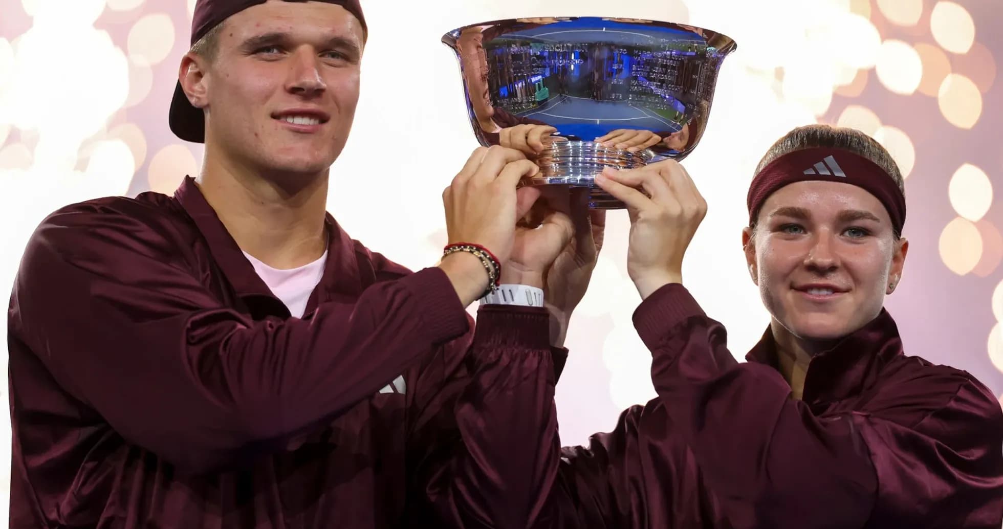 Players celebrating with trophy after winning championship