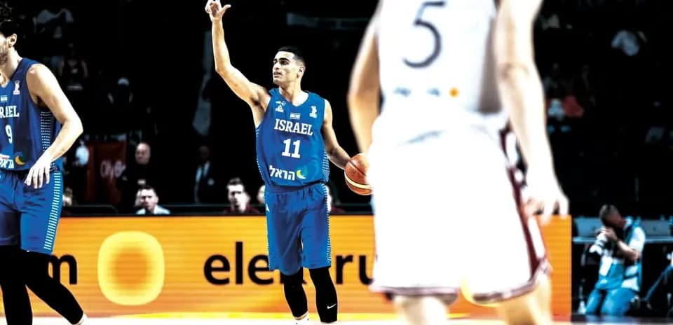 Player 11 of Israel signaling during basketball game