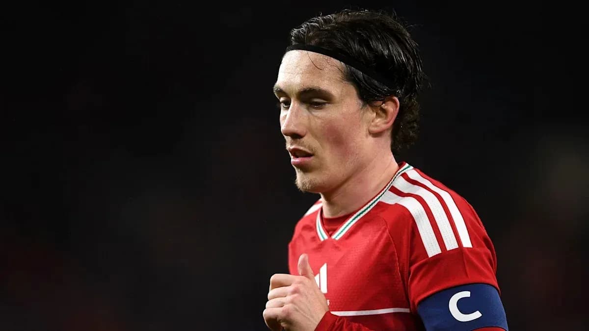 Player wearing red jersey and captain's armband