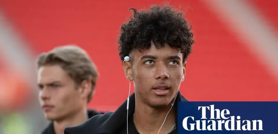 Young player walking with headphones before match