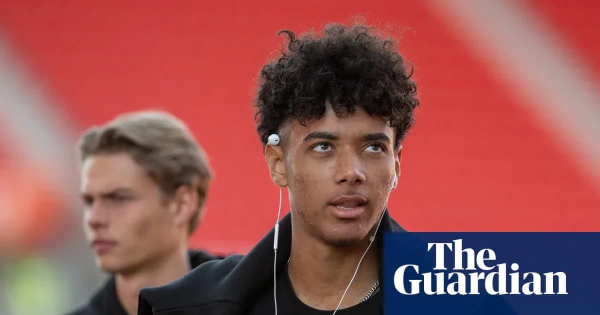 Young player walking with headphones before match