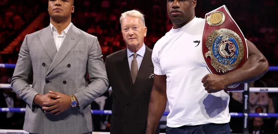 Two boxers and a promoter at a press event