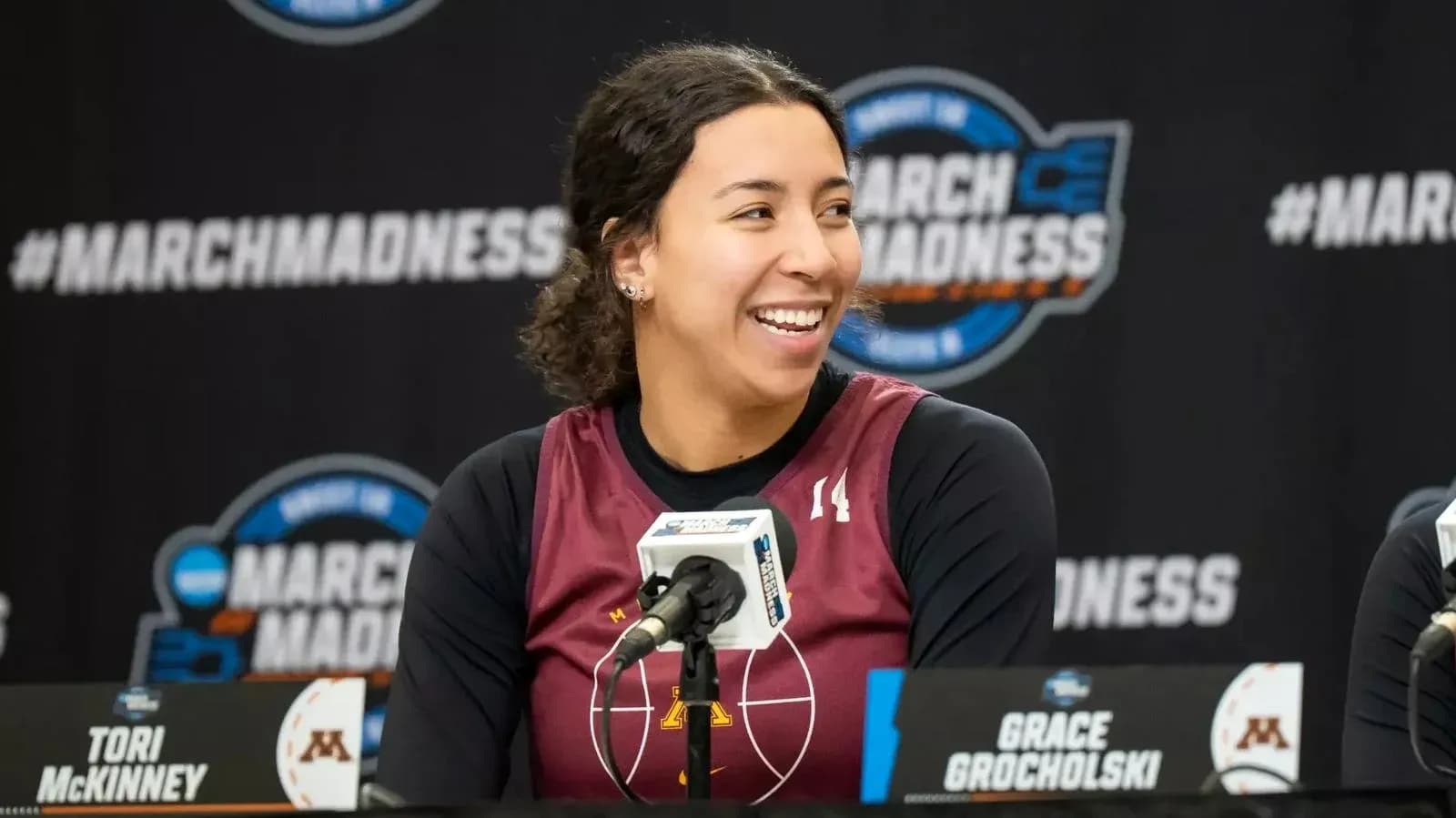 Tori McKinney smiling at March Madness press conference