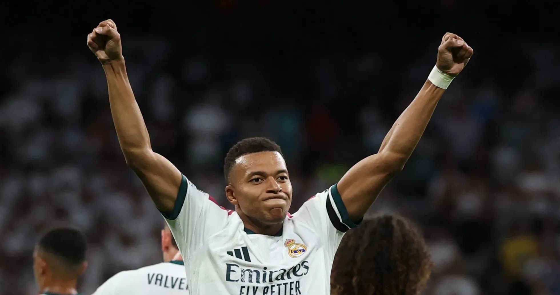 Player celebrating victory with raised arms