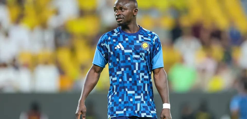 Player wearing blue training kit on the field