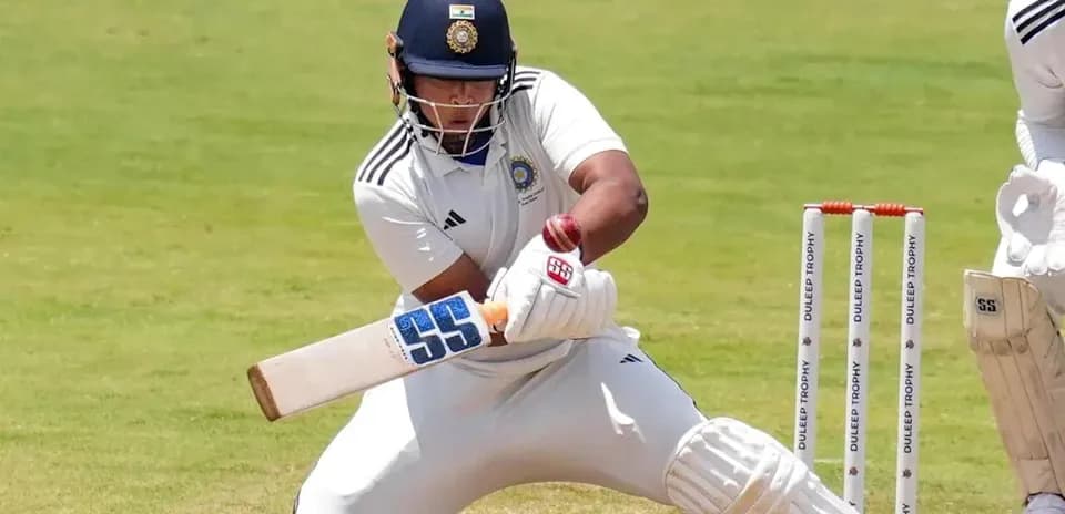 Batsman playing a shot during a cricket match
