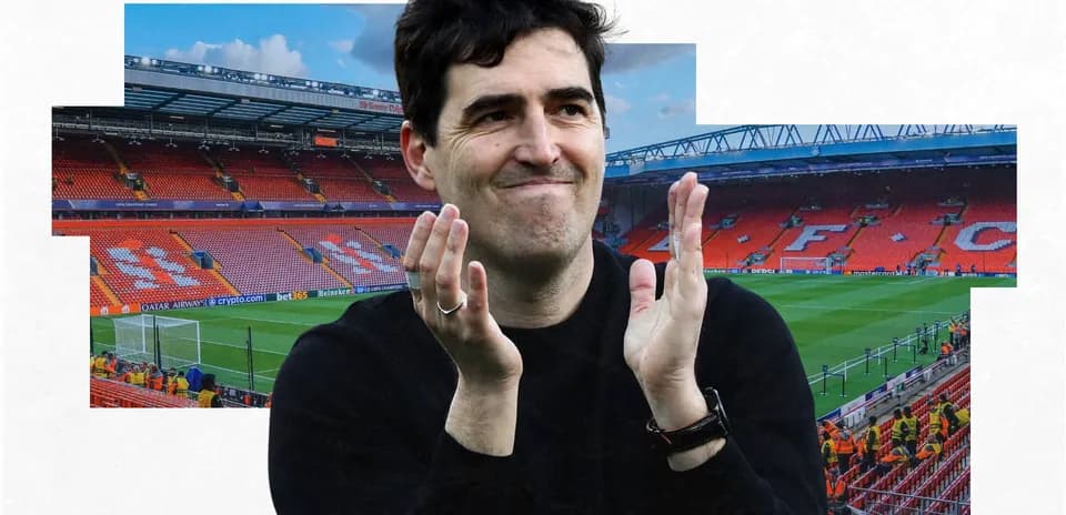 Man clapping in empty stadium stands at Anfield